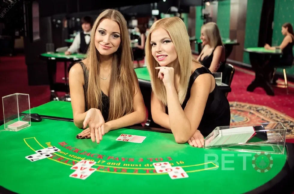 Ruang permainan kasino live dengan tampilan meja dan dealer
